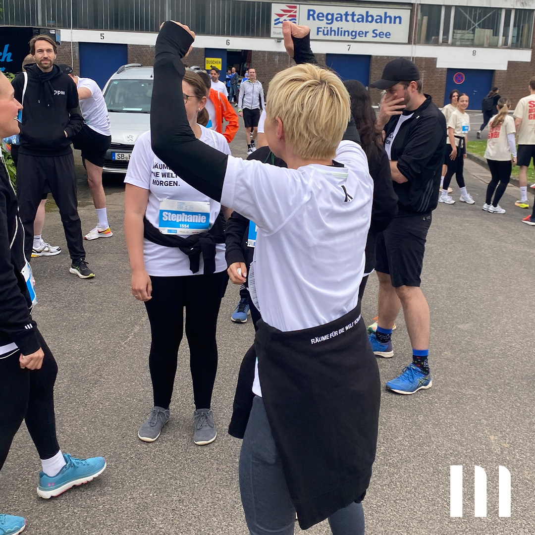 ppm-Team vor dem Start des Firmenlauf 2026 in Köln an der Regattabahn.